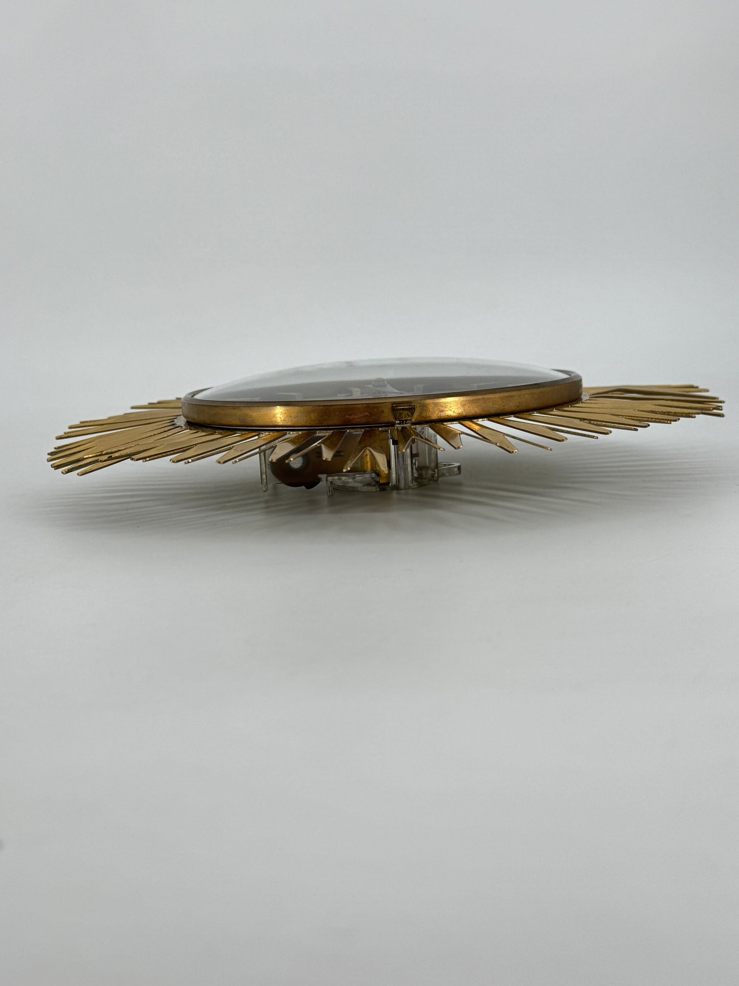 Eine Sunburst Wanduhr von Richter Electric aus Messing, Deutschland 60er Jahre